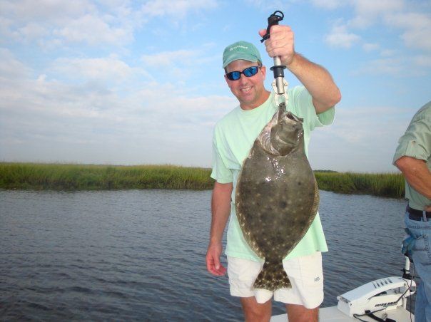 Angler holding a flounder